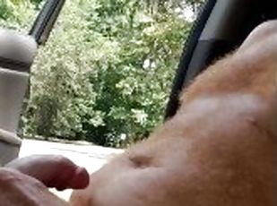Naked hairy ginger playing with dick while a guy watches and a guy passes on a motorcycle