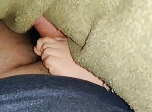 My stepsister gives a footjob under the blankets while watching a movie