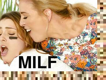 Glamorous blonde MILF with juicy melons fucks young girl on the couch