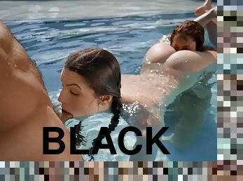 Horny black dude fucks two mischievous babes by the pool
