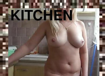 Desirable blonde pleasures herself in the kitchen