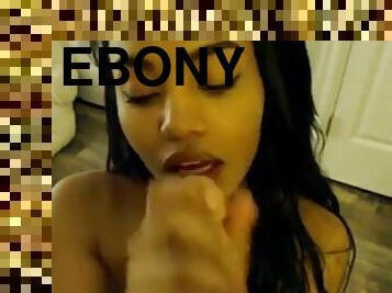 Ebony babe sucks dildo