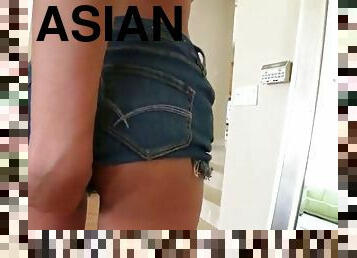 Asian bitch sticks toy in her gash