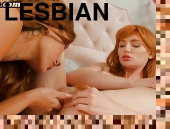 Redhead lesbian pussy licking and fingering girlfriend in a couple