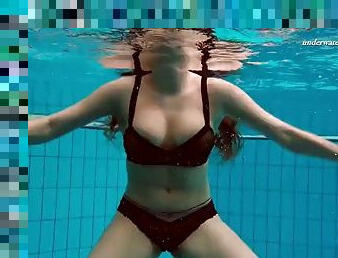 Fun Czech girl Vesta swims naked and horny.