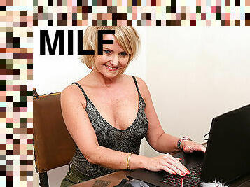 Milf masturbating behind her laptop