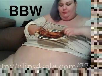 Girl feeds her big belly
