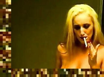 Naked girl smoking in her bathroom