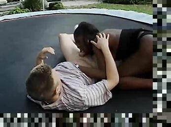 Black tgirl on trampoline gives a BJ