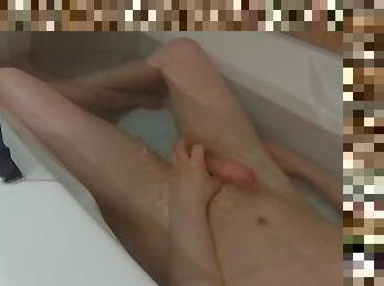 Horny femboy masturbates to orgasm in the bath
