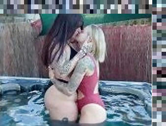 Young lesbian couple in sexy bikinis kissing