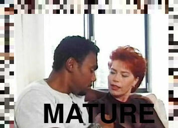 Mature redhead Kira Red is getting black dick