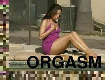 A hot chick sunbathing by the pool ends up fingering her pussy!