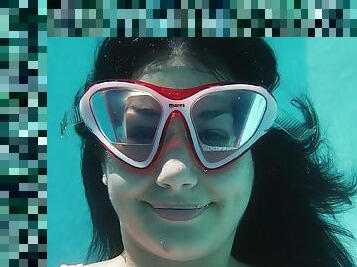 Sexy one piece swimsuit on a girl working out underwater