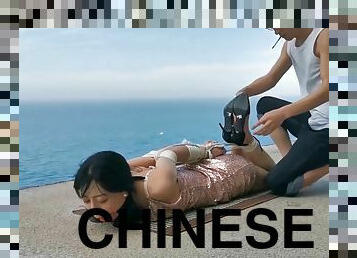 Chinese girl public bondage seaside