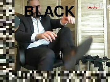 Suited Master shows off black leather formal shoes four pairs of socks and size 13 feet PREVIEW