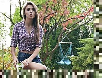 Adorable teen presents her juicy big tits outdoors