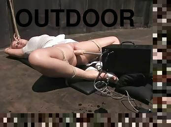 Gorgeous blonde fucks machines outdoors