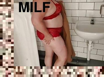 NZ MILF slut pisses in mens public toilet then clothing change for public display walk. Pt 1