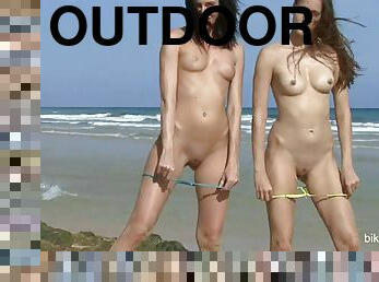 two girls take off bikinis