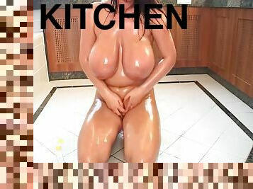 Flora Oiled Up brunette babe on the kitchen floor - shiny tits