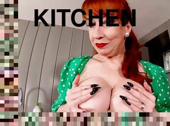 Red XXX fingers herself in the kitchen - Mature