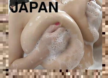 Japanese chick shows off her slender body and huge breasts in bathtub