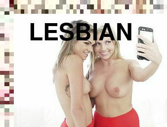 Lesbian blondes focus on pussies of each other on couch