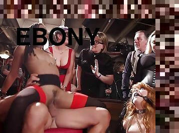 Redhead and ebony made love at bdsm sex orgy