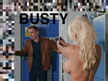A busty female cop takes a huge cock in the locker room.