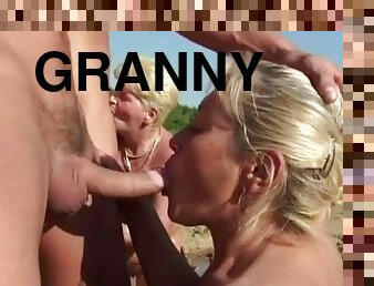 Foursome granny fucking in the mud