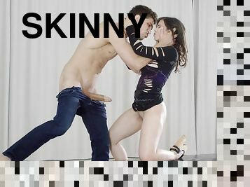 Skinny slut sucks huge cock and gets her face