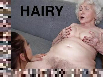 Old hairy granny pampering a busty babe