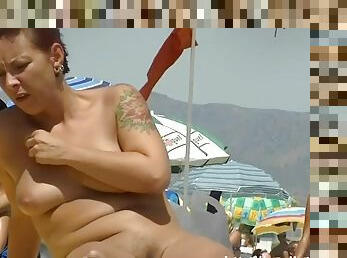 Nude beach voyeur shoots girls naked sunbathing