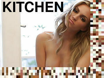 Beauty bares her body in kitchen