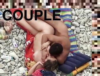 Couple making love on the beach and caught by voyeur