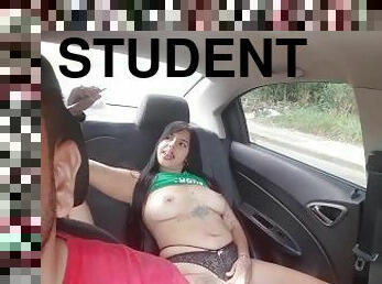 Two students touch each other in the back seat of the uber and the driver doesn't even notice.