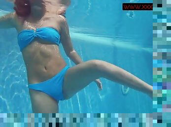 The porn star Mia Ferrari in a blue bikini underwater