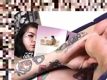 Barefoot tattooed girl gets a nice massage