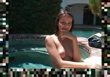 Girl goes skinny dipping in the pool