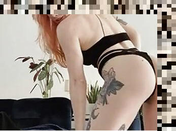 Tattooed redhead slut strips for the camera