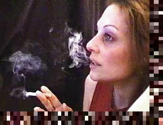 Webcam girl lights up a cigarette