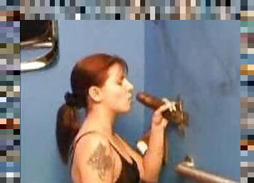 Black dick in her mouth at the gloryhole