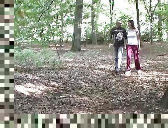 A sexy German slut gets a double cumshot in the middle of the woods