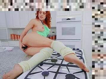 Redhead toys pussy in the kitchen  for a morning solo