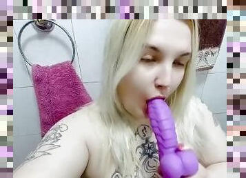 Naughty chubby blonde plays with dragon dildo in bathroom