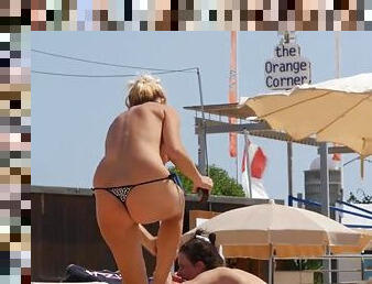 Spying on topless milfs at the beach