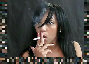 Sexy Latina smokes cigarette sensually