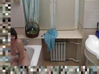 Solo teen masturbates in the shower