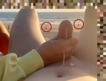 Hand job on a nude beach. We were caught jerking off at sunset near the ocean.